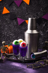 Halloween purple cocktail with eyes.