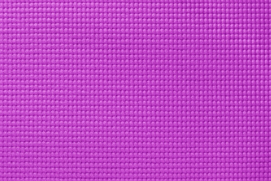 Purple yoga mat texture, pattern of rubber for background.