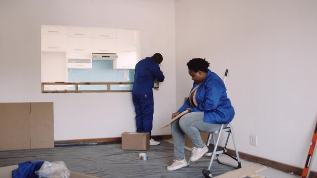 Black Couple Doing DIY in their Apartment