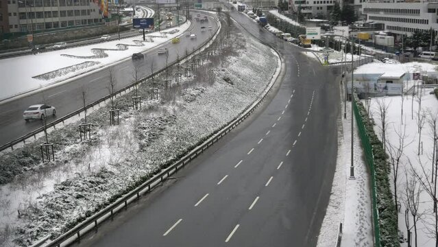 snowfall in istanbul busy highway .