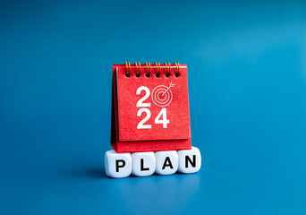 Happy new year 2024 banner background. 2024 numbers year on red small desk calendar cover standing...