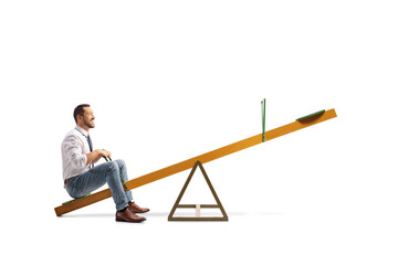 Businessman sitting on a seesaw alone