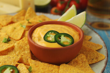 Corn tortilla chips with cheese sauce
