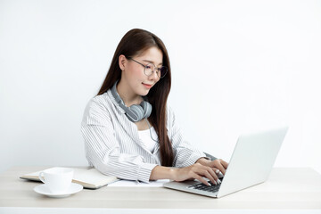 Asian businesswoman sit at their desks and calculate financial graphs showing results about their investments, planning a successful business growth process