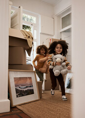 Girl, children and happy in new home, running and toys with game, moving and excited for new...
