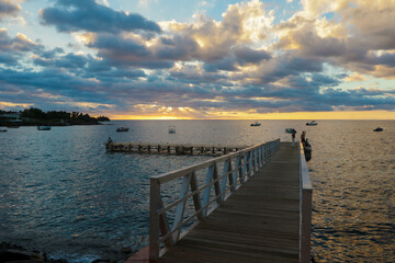 Fototapeta premium Dramatic View to the Wooden Pier in the Sunset light, Guadeloupe
