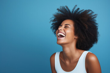 Portrait of a Happy Woman Laughing Black Woman Blue Background