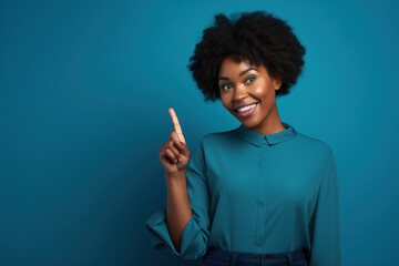 Woman Smiling Pointing Up Blue Background Black Woman