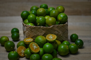 Calamansi oranges on wooden background