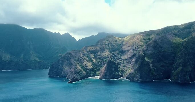 Clouds moving across lush green mountains on Fatu Hiva Island in the Marquesas Islands in tropical South Pacific French Polynesia
