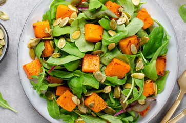 Pumpkin Salad with Arugula and Pumpkin Seeds, Salad Mix with Roasted Pumpkin, Fresh Vegan Autumn Salad