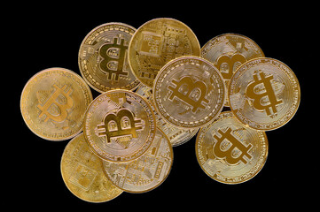 Bitcoin (BTC) coin, an image of a cryptocurrency in the form of a gold coin lying on a black background
