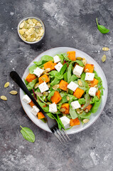 Pumpkin Salad with Arugula, Feta Cheese, and Pumpkin Seeds, Salad Mix with Roasted Pumpkin, Autumn Salad