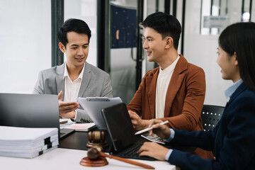 Team lawyer businessmen working with paperwork on his desk in office workplace for consultant lawyer in office.