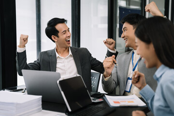 Happy smiling businessman feel happy work complete Teamwork success, success at work in the office concept.