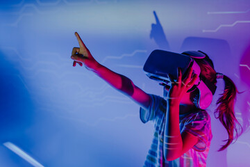 Girl gesturing with virtual reality simulators