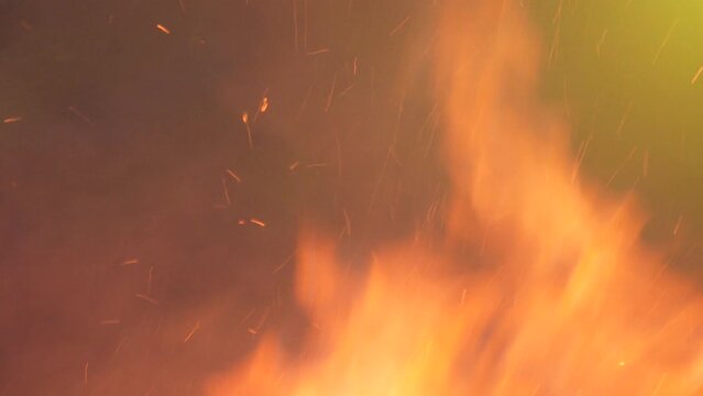 the fire blazes on, casting a mesmerizing glow and radiating intense heat. The swirling flames and glowing embers make this background a powerful choice