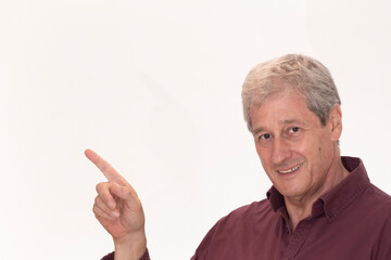 portrait of a man pointing at a blank space, shows with his finger