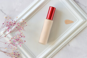 Skin care product ad. Minimal beauty product styling and photography. Foundation texture. Foundation photography styling on Flat Lay Setting. 
