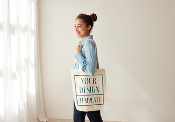 Mockup of woman carrying customizable tote bag, side view