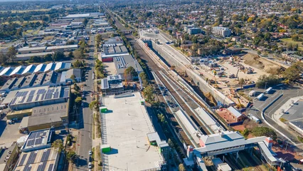 Outdoor kussens Aerial drone view of the construction site of the new metro station at St Marys in Western Sydney, NSW Australia on a sunny day in August 2023  © Steve