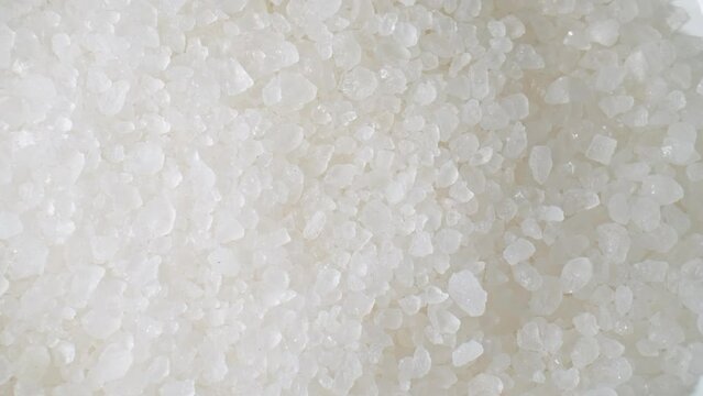 Flower of Salt, a premium sea salt, forms delicate crystals on salt ponds' surfaces. Hand-harvested, it's prized for its subtle flavor and adds a gourmet touch to dishes.
