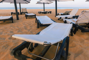 Sunbeds, Beach loungers, Relaxation, Beachside, Umbrellas,