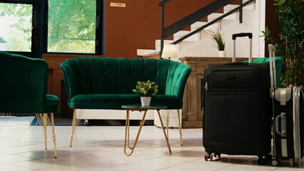 Empty exotic hotel lounge area with classy stylish couch and furniture, modern interior design. Resort reception counter luxurious front desk lobby with marble floors, expensive space.