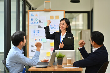 Business marketing team celebrating success goals, winning and achievement. Motivation, unity, solidarity and teamwork.