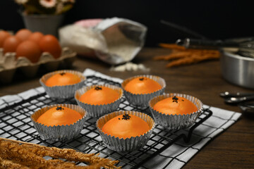 Chinese pastry with stuffed salted yolk on wooden kitchen table. Traditional dessert for Chinese Mid-Autumn festival.