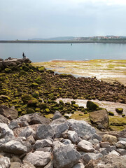 Solo Fisherman - view Hendaye and Bidasoa river from Hondarribia Basque Country