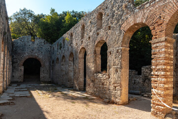 Fototapeta na wymiar Arches in the Great Basilica in the archaeological ruins of Butrint or Butrinto National Park in Albania