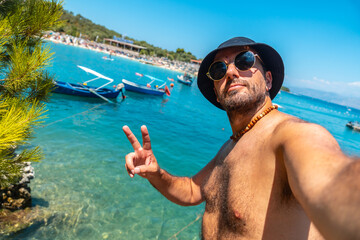 Selfie of a tourists on the beaches of Ksamil in the Albanian riviera enjoying the summer holidays