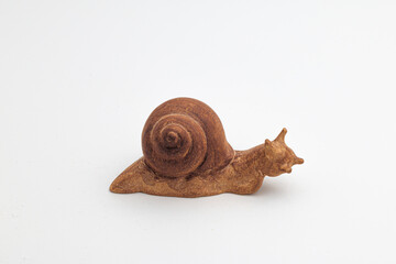 Close up of hand carved wooden snail