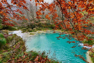 Turquoise water in the source of the Uderra River natural Park Urbasa-Andia, Baquedano, Navarre, Spain, Europe.