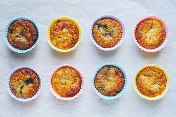 Delicious freshly baked gluten free berry muffins made with coconut flour with no added sugar, top view. Healthy sweet food, flat lay style.