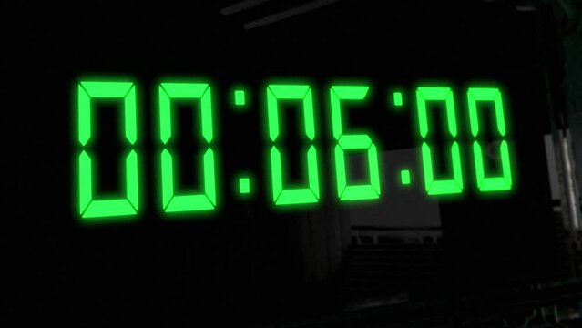 High quality CGI render of a digital countdown timer on a wall-mounted screen, with glowing green numbers, counting down from 10 to zero, with dramatic left to right camera move