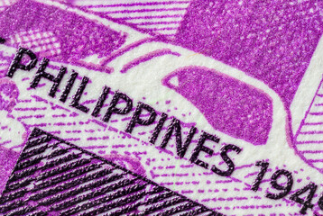 Extreme macro photography of a 100 Peso banknote. Ultra close up of a one hundred filipino peso note. Legal Tender for private and public of the island state of the Philippines. Microscopic capture
