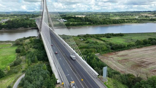 Traffic crossing bridge from Waterford side of The Francis Meagher Bridge Ireland on a bright summer day