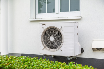Air source heat pumps installed outside of city house