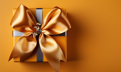 Gift box with a bow on a yellow background.