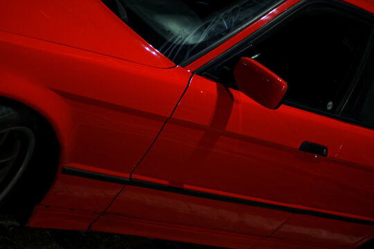 Old european car in the city center at night