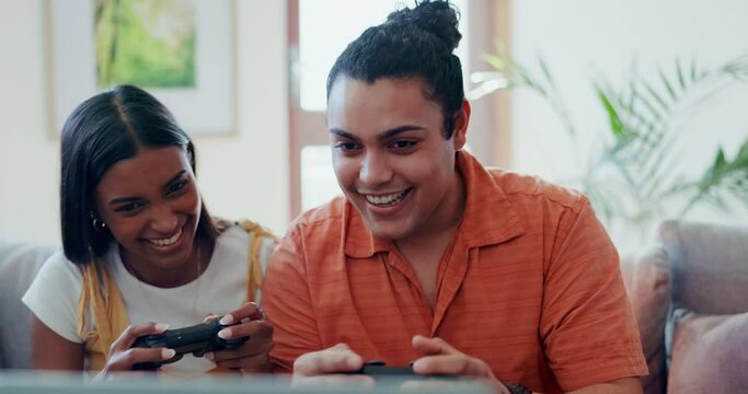 Home, smile and couple with video games, relax and playful on a weekend break, laughing and bonding. People, man and woman on a couch, entertainment or fun with console controller, crazy or challenge