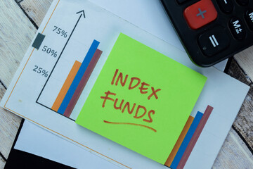 Concept of Index Funds write on sticky notes isolated on Wooden Table.