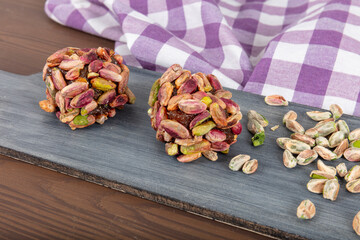 Turkish Dessert Cezerye with Hazelnut, Almond or pistachio. Turkish delight with carrot nuts atom...