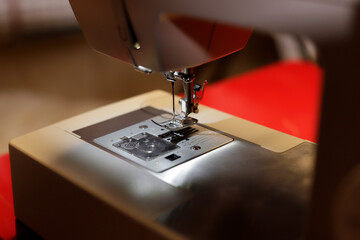 detail of electric sewing machine sewing