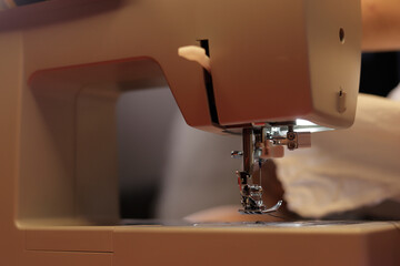 detail of electric sewing machine sewing