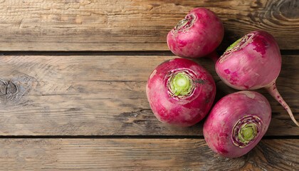 Red turnips on wooden table, flat lay. Space for text