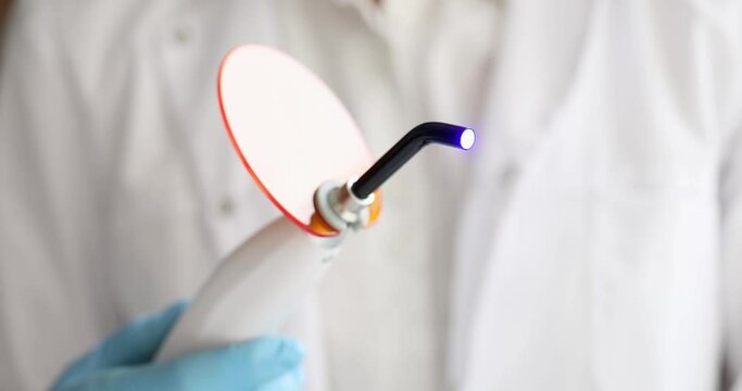 Dental UV polymerization lamp and artificial jaw model. UV lamp. Polymerization UV lamp concept