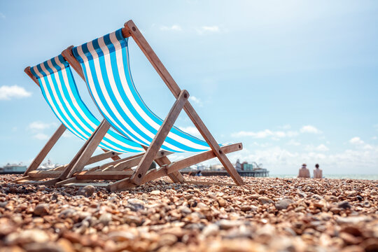Deck Chairs on the beach at the seaside summer vacation